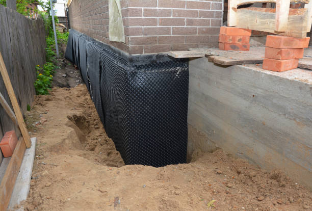 Happy homeowners after waterproofing job in Martville